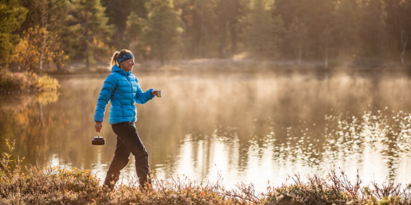 Finland girl walking by lake